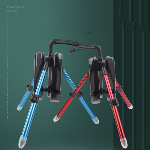 Two tripod stands, one blue and one red, on a green background.